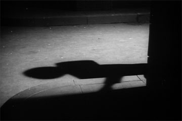 Shadows in the alley of The Seventh Victim produced by Val Lewton for RKO Radio Pictures, directed by Mark Robson, starring Tom Conway, Jean Brooks, Isabel Jewell, Kim Hunter, and Hugh Beaumont